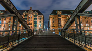 bridge between buildings at night